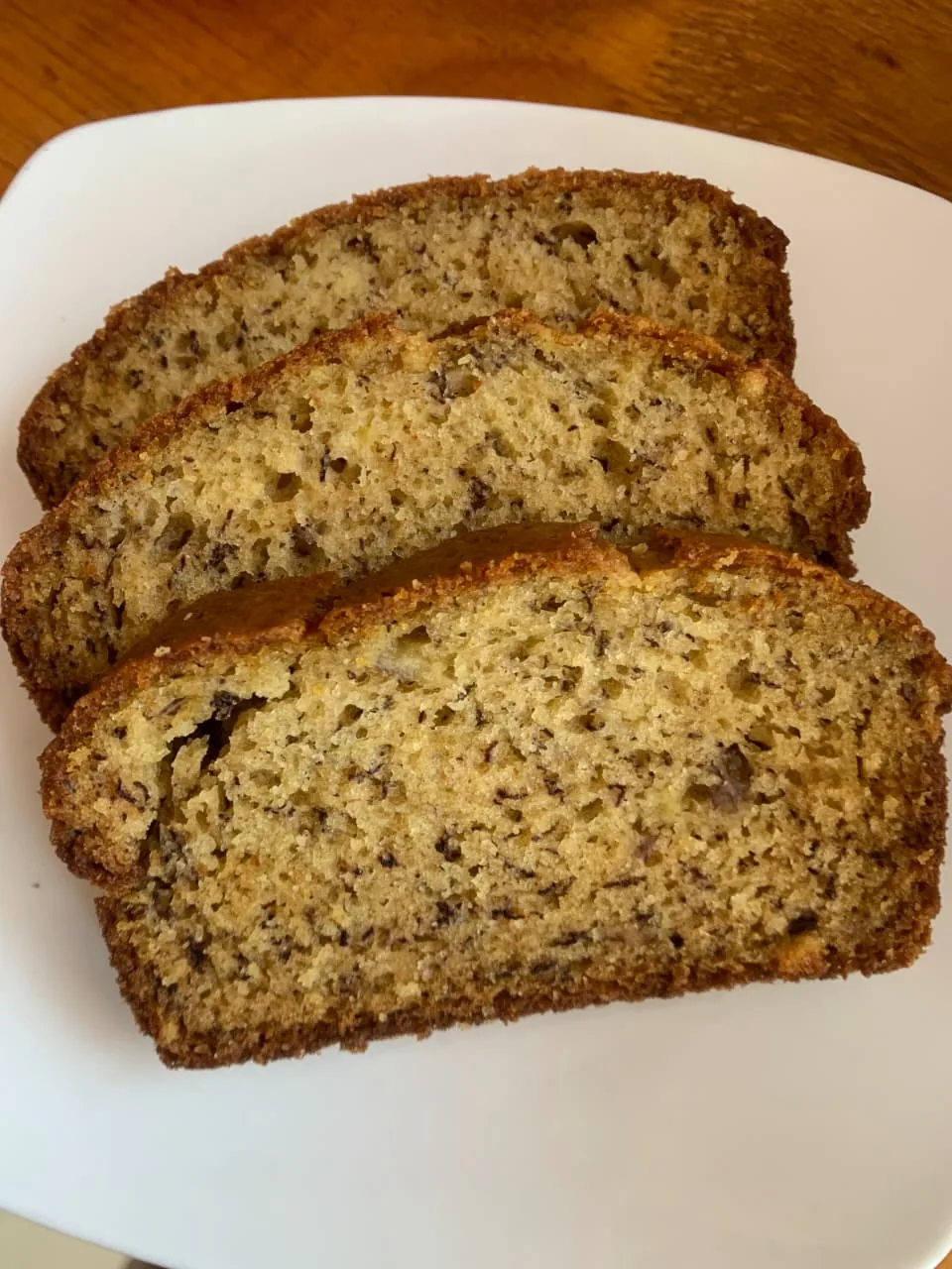 Slices of classic banana bread on a white plate